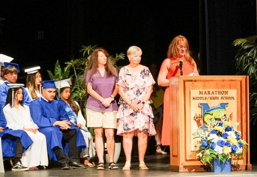 a group of people standing on top of a stage