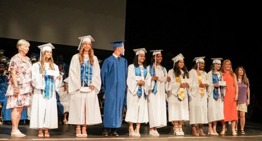 a group of people that are standing on a stage