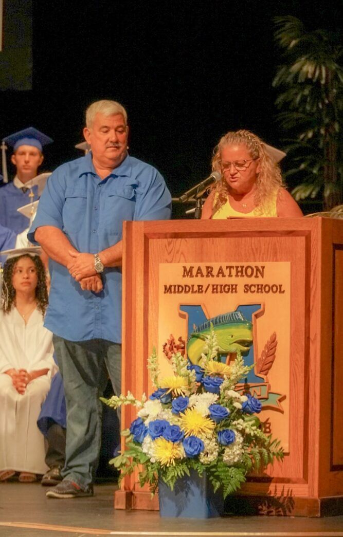 a group of people standing around a podium