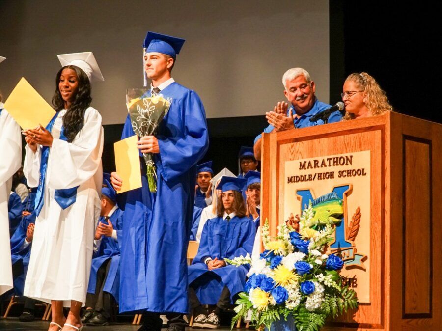 a group of people that are standing in front of a podium