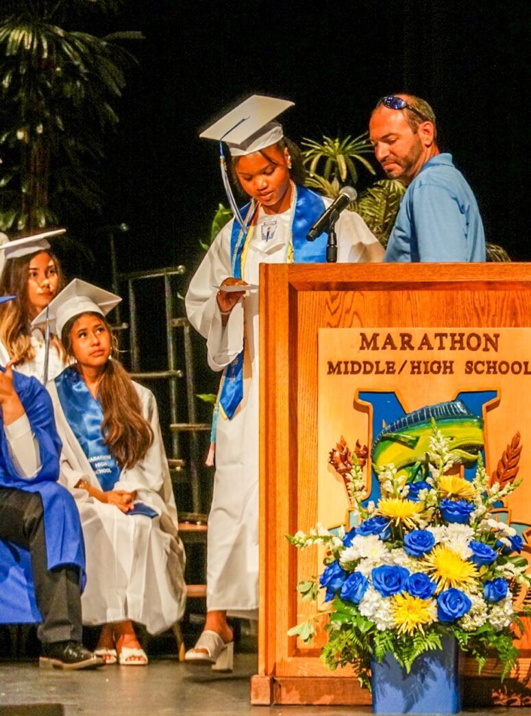 a group of people that are standing in front of a podium