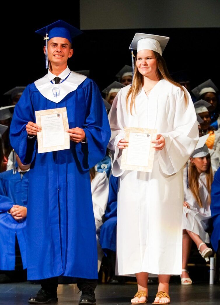 a couple of people standing on a stage