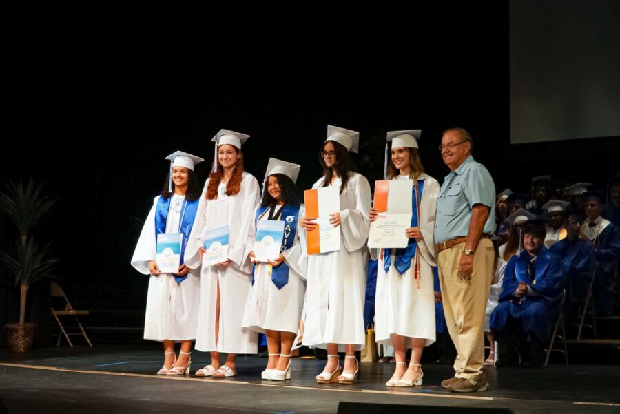 a group of people standing on top of a stage