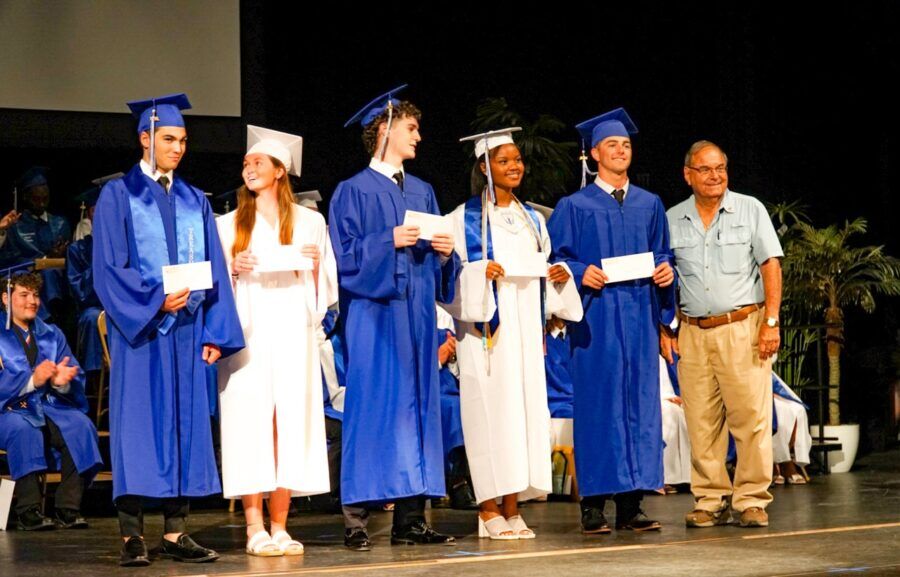 a group of people standing on top of a stage