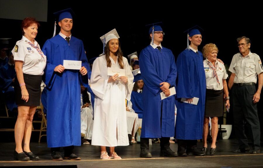 a group of people standing on top of a stage