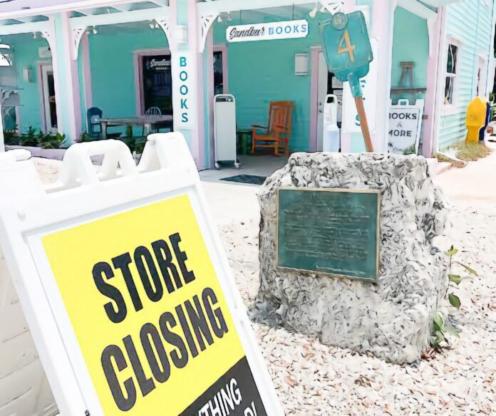 Sandbar Books 2 copy a store closing sign in front of a building