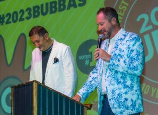 TOP 10: YOU MIGHT BE A BUBBA IF… two men standing at a podium with a microphone