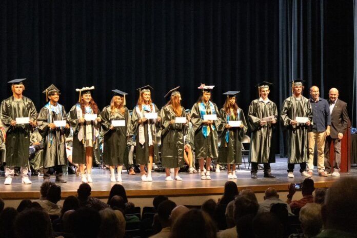 ICC scholarship 1 a group of people standing on top of a stage