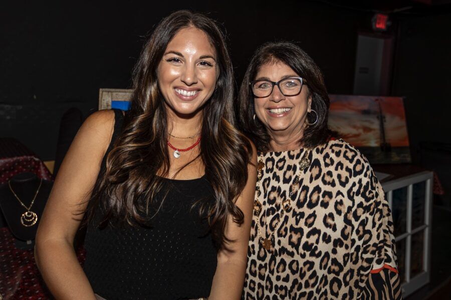 a couple of women standing next to each other