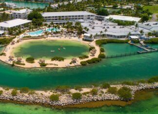 GET READY TO PARTY: LAST CALL FOR VOTES AS BEST OF MARATHON ANNOUNCES VENUE an aerial view of a resort surrounded by water