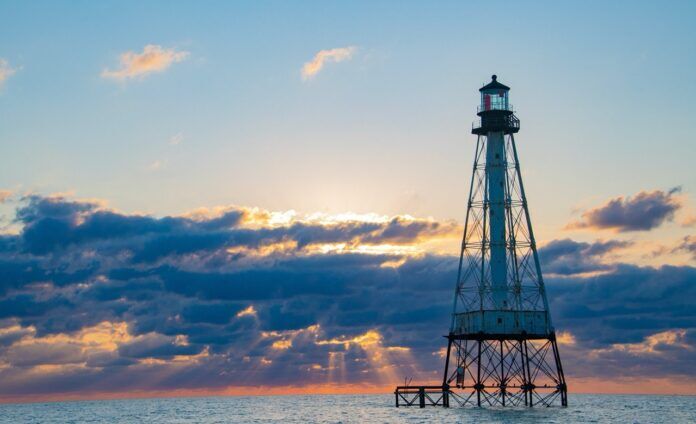 Alligator Lighthouse Large a lighthouse in the middle of the ocean at sunset