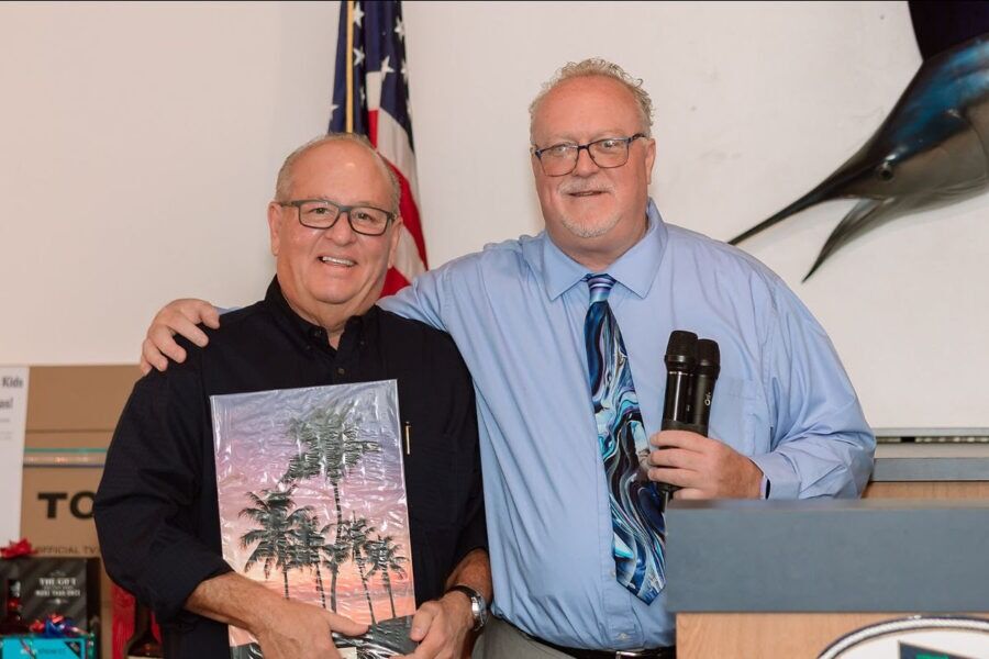 a couple of men standing next to each other