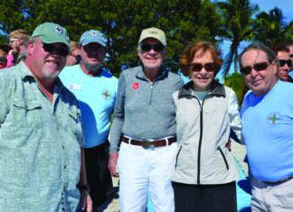 JOHN BARTUS: JIMMY CARTER LIVED A LIFE OF SERVICE TO HUMANITY a group of men standing next to each other