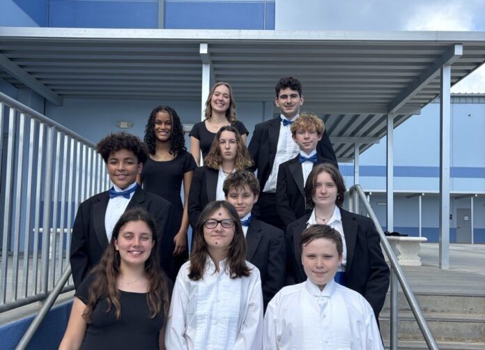 a group of young people standing next to each other