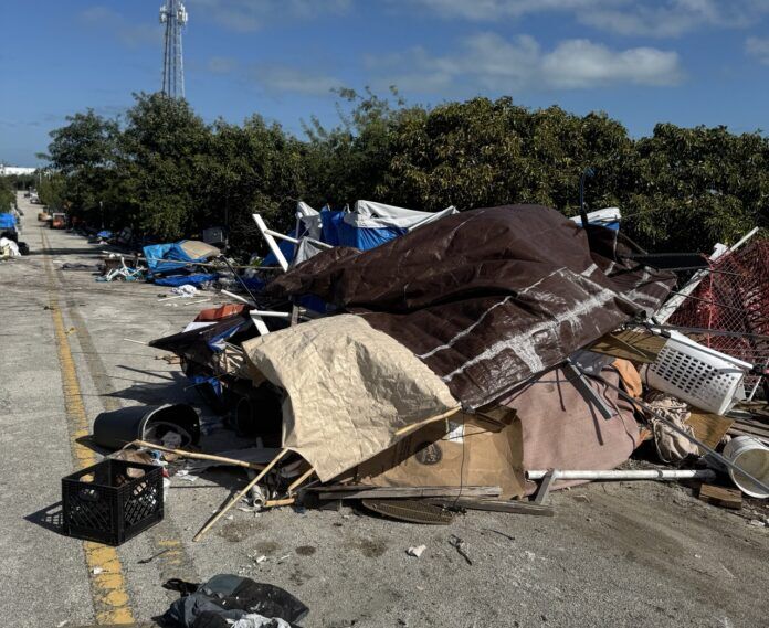 a pile of trash sitting on the side of a road