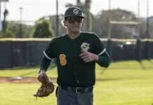HURRICANE OFFENSE EXPLODES FOR 28 KNOCKS IN 2 GAMES a man in a baseball uniform holding a catchers mitt