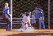 KEY WEST & MARATHON SOFTBALL GEAR UP FOR POSTSEASON PUSH a softball player sliding into home plate during a game