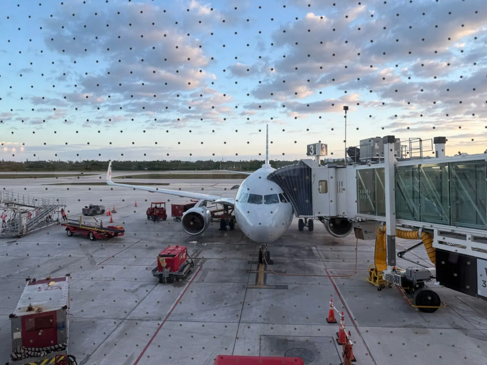an airplane is parked on the tarmac at the airport