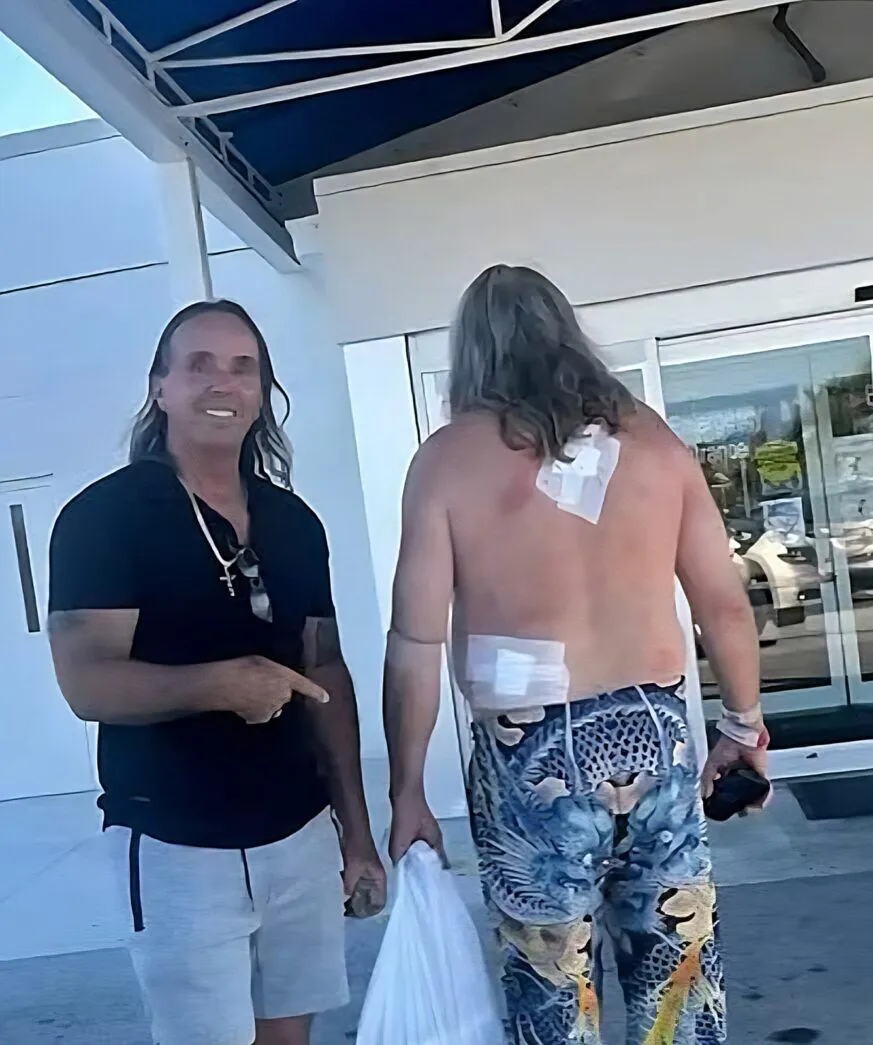 a couple of men standing next to each other