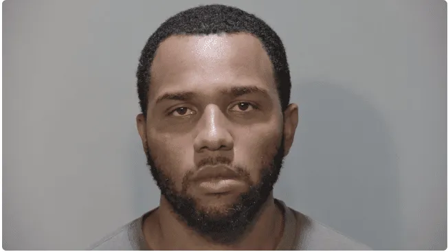 a mug shot of a man with a beard