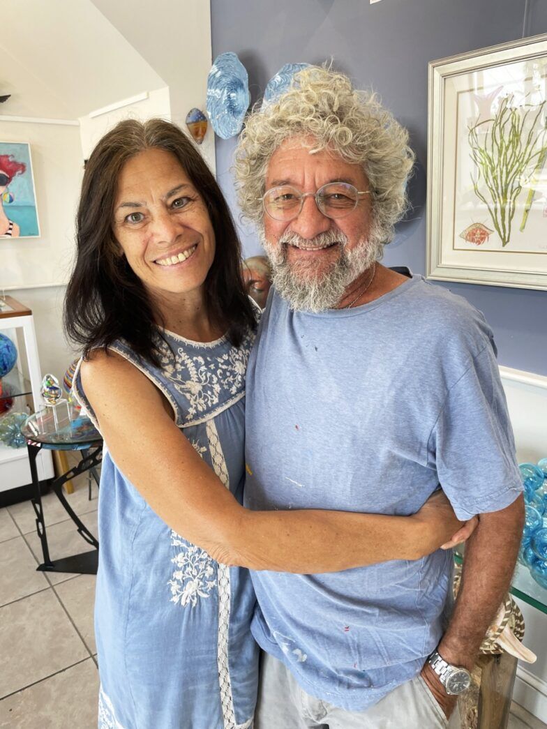 a man and a woman hugging in a room