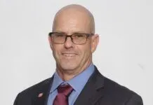 a man in a suit and tie posing for a picture