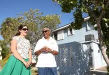 LETTER TO THE EDITOR: COMMUNITY URGED TO TAKE ACTION ON PROPOSED HEALTH AND HUMAN SERVICES FUNDING CUTS a man and a woman standing in front of a house