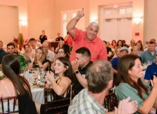 BEST OF MARATHON BRINGS GRINS & WINS FOR ALL AT HAWKS CAY a group of people sitting at tables in a room