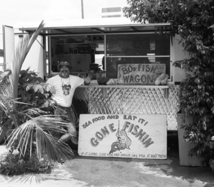 a man standing in front of a food truck