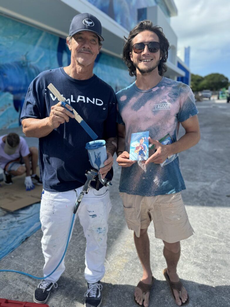 a couple of men standing next to each other