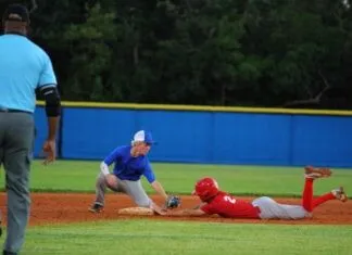 a baseball player sliding into a base during a game