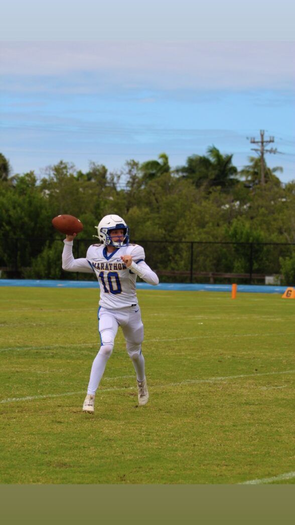 a football player throwing a ball on a field