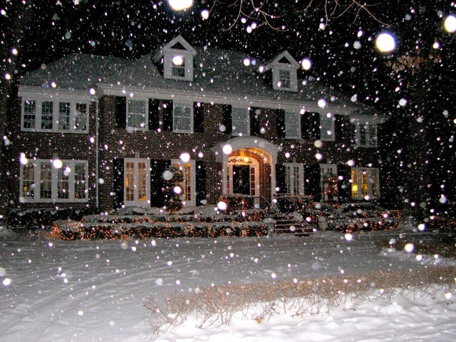 a large house covered in snow at night