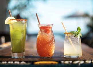 three different types of drinks sitting on a table