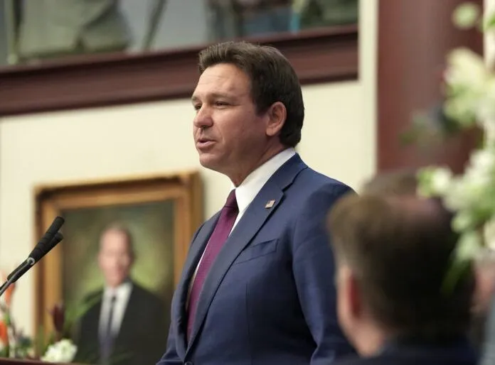 a man standing at a podium in front of a microphone