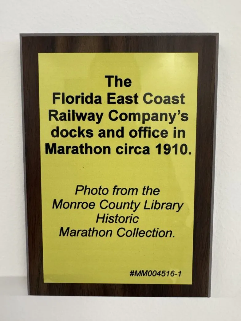 a sign posted on the wall of a library
