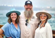 KYLE CARTER BRINGS THE MAGIC OF MILE 0 FEST BACK TO KEY WEST a man with a long beard standing next to two women