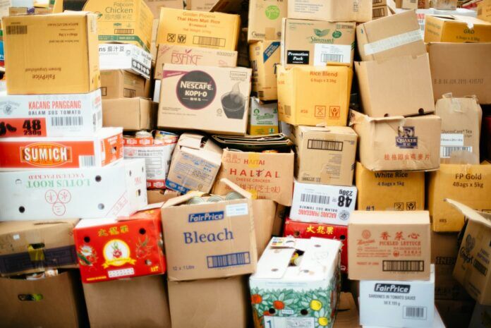 Photo by CHUTTERSNAP cardboard box lot