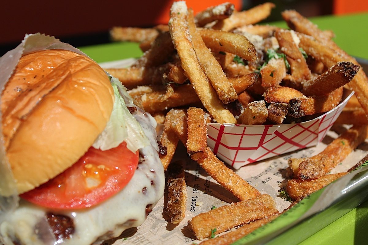 The Brisket Burger with parmesan cheese and herb topped fries. 