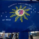A blue and white sign - Conch Republic