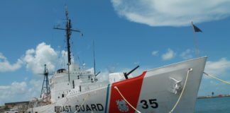 #News: All aboard! (The USCGC Ingham is on display at Truman Annex) - A large ship in the background - Guided missile destroyer