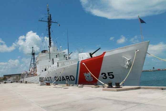 #News: All aboard! (The USCGC Ingham is on display at Truman Annex) - A large ship in the background - Guided missile destroyer