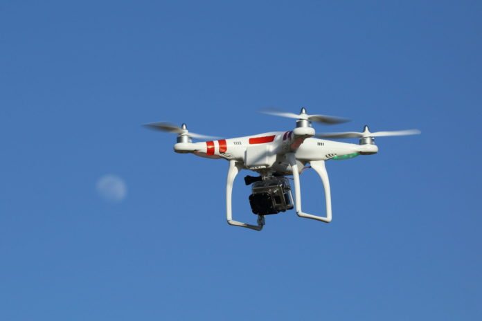 #News: City looks to regulate drones (City staff and business owners seek resolution) - A helicopter flying in the air - Unmanned aerial vehicle