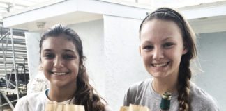 #News: Girl finds message in a bottle - A couple of people are drinking from a glass posing for the camera - Alcoholic Beverages