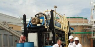 #News: Wastewater plants under new management - A group of people riding on the back of a truck - Transport