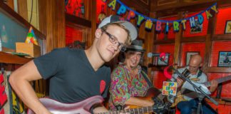 Jam session for Larry Baeder’s B’day - A man and a woman holding a guitar - Guitar