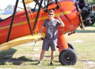 #DayTripping: Bi-plane flight & Brutus Seafood - A man standing in front of a plane - Aviation