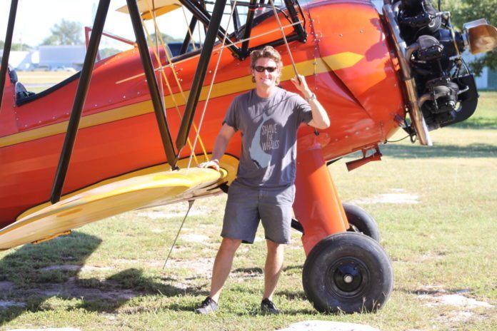 #DayTripping: Bi-plane flight & Brutus Seafood - A man standing in front of a plane - Aviation