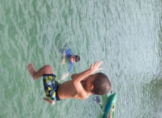 #DayTripping: Pigeon Key & Sunset Grille - A young man riding a wave on a surfboard in the water - Extreme sport