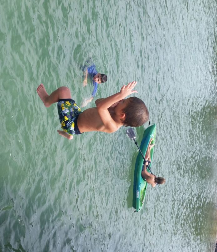 #DayTripping: Pigeon Key & Sunset Grille - A young man riding a wave on a surfboard in the water - Extreme sport